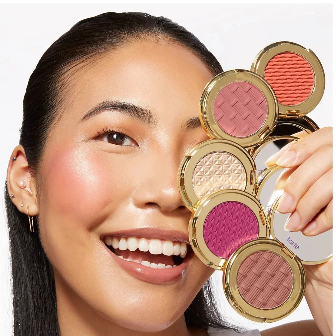 Model applying Tarte Amazonian clay blush – radiant cheek look