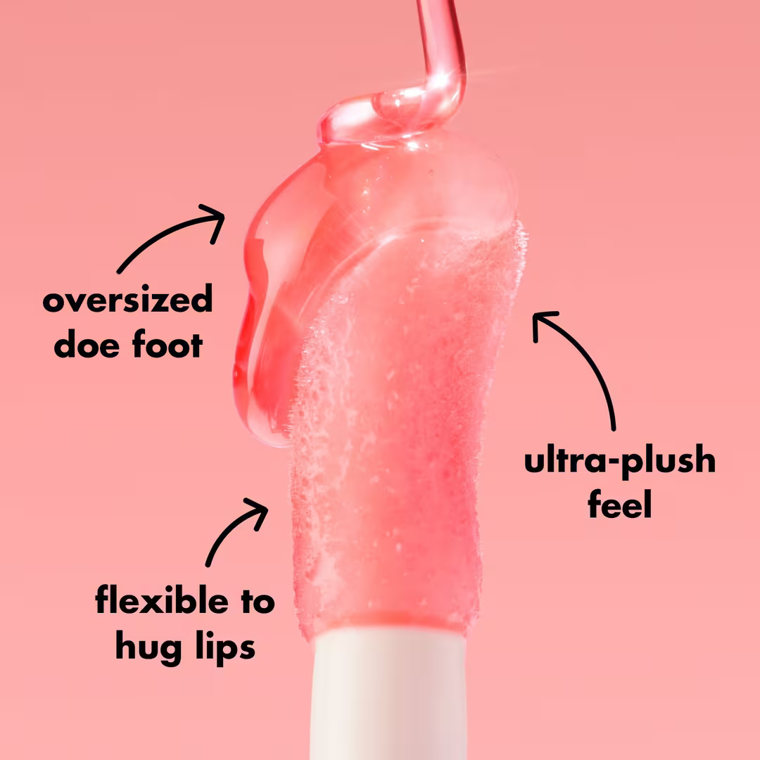 Swatch of e.l.f. Glow Reviver Lip Oil on skin showing clear, glossy finish with subtle shine