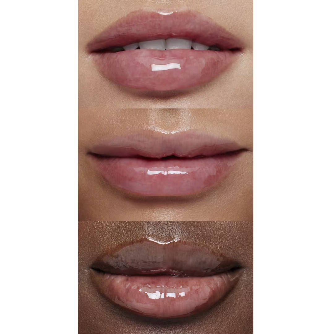 Model applying e.l.f. Glow Reviver Lip Oil to lips for a high-shine, hydrated look