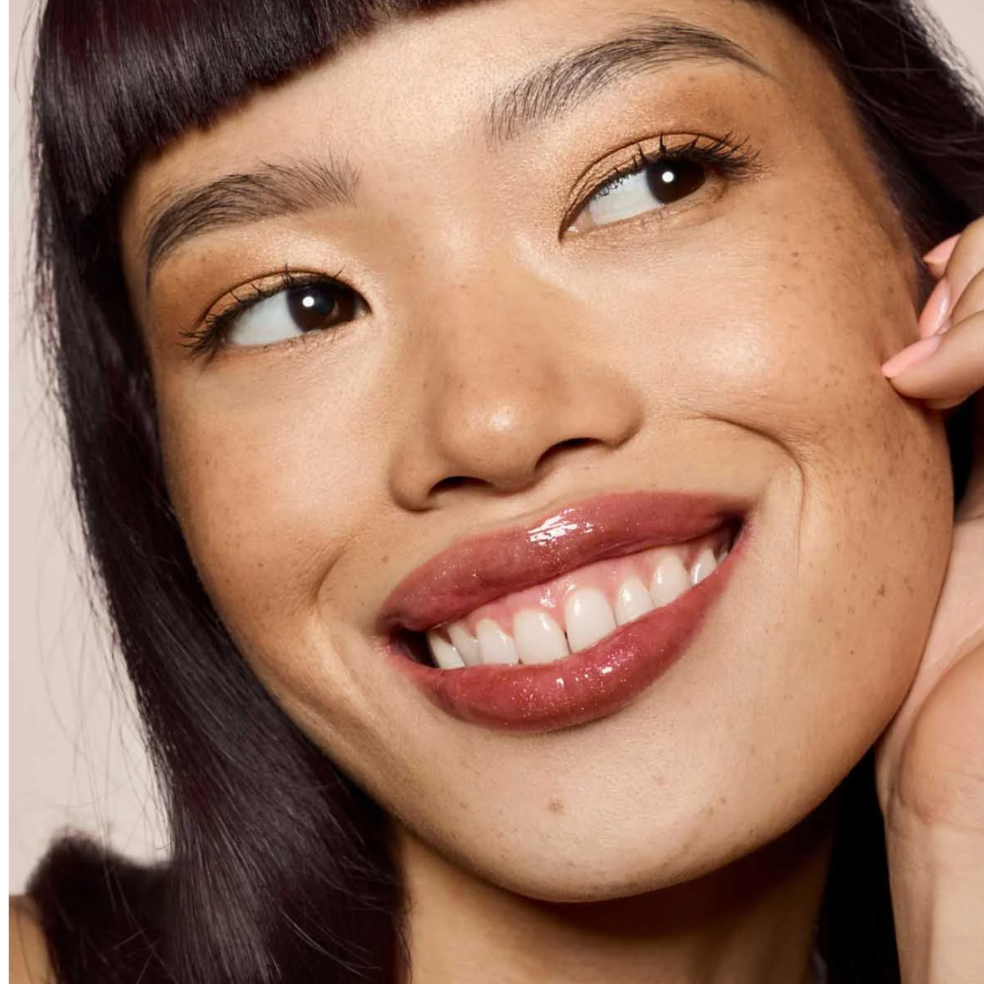 Fenty Beauty lip duo showing luminous lip gloss and nourishing lip oil in sleek packaging