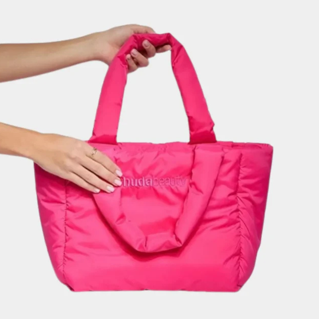 "HUDA BEAUTY Pink Tote Bag with logo on front, displayed on white background"

